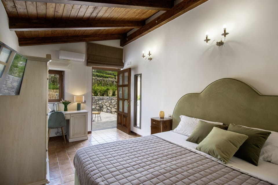 Quadruple Room, Garden View | In-room safe, desk, laptop workspace, blackout drapes