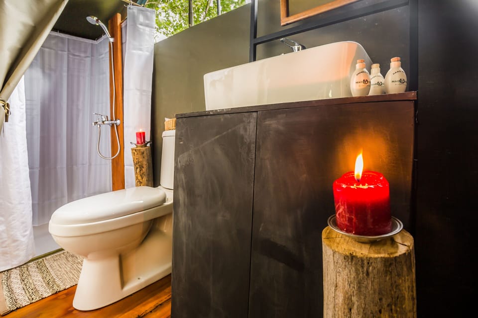 Glamping suite bordering Udawalawe with bush walk | Bathroom | Shower, free toiletries, slippers, bidet