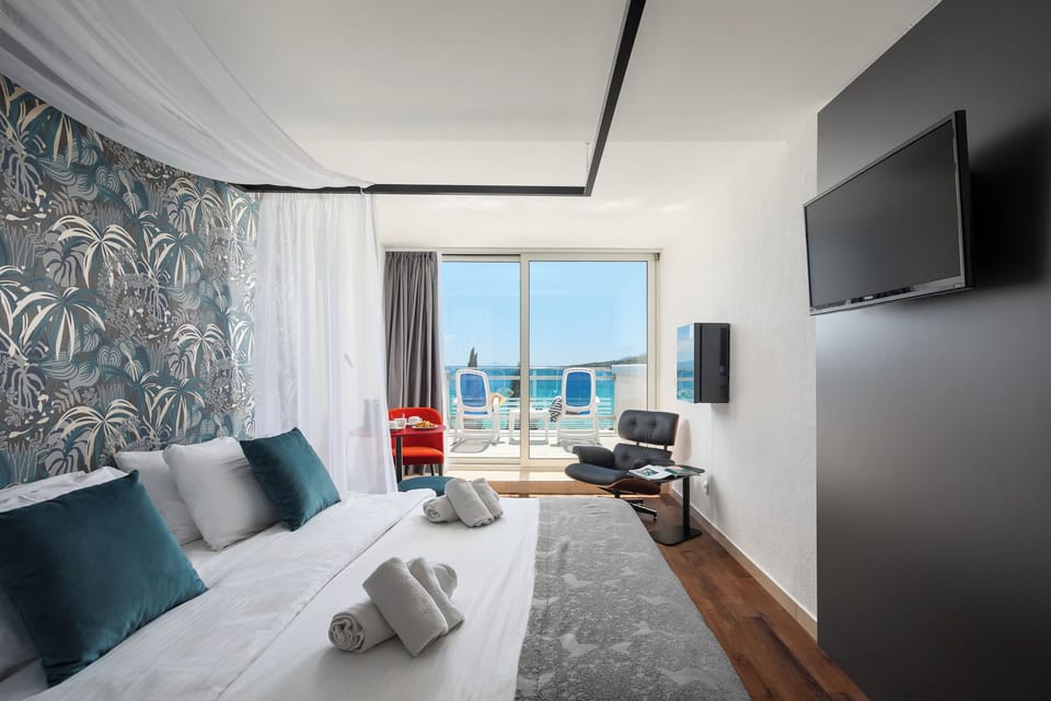 Deluxe Double Room, Balcony, Sea View | In-room safe, desk, blackout drapes, cribs/infant beds