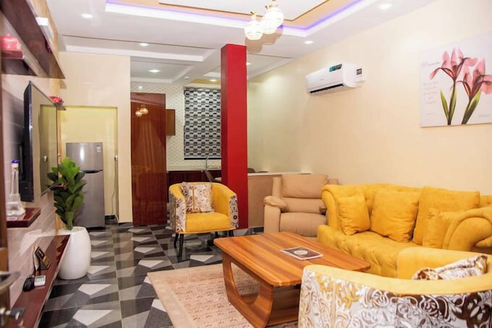 Deluxe Apartment, Balcony, City View | Living area | Flat-screen TV