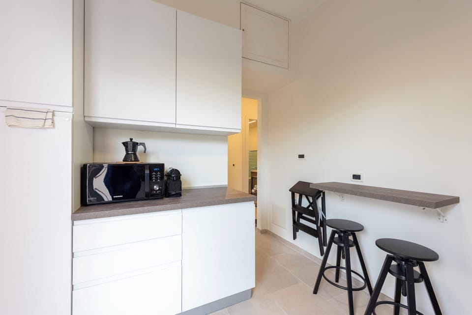 Apartment, 2 Bedrooms, Balcony | Private kitchen | Espresso maker, dining tables
