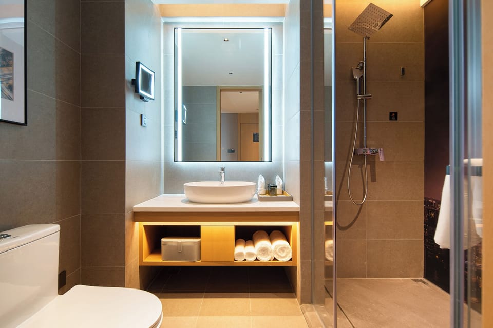 Shower, free toiletries, hair dryer, slippers