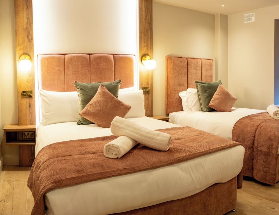 Family Triple Room | Memory foam beds, iron/ironing board, travel crib, free WiFi