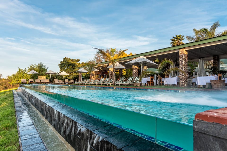 2 outdoor pools, pool umbrellas, sun loungers