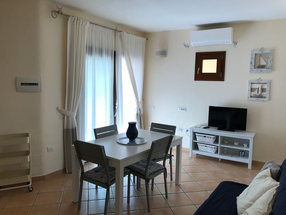 Classic Apartment | Living area | 32-inch LCD TV with satellite channels