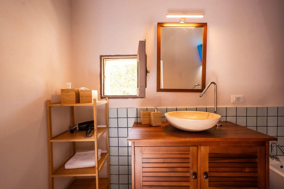 Deluxe Double Room, Patio, Garden View | Bathroom | Separate tub and shower, free toiletries, hair dryer, bathrobes