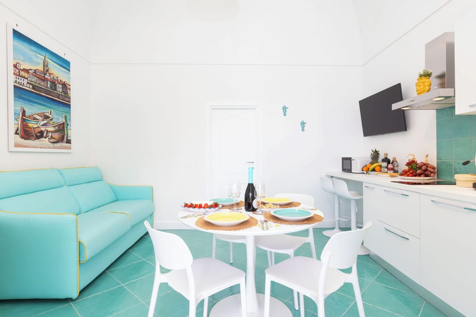Apartment, Sea View | Living area | 32-inch flat-screen TV with digital channels
