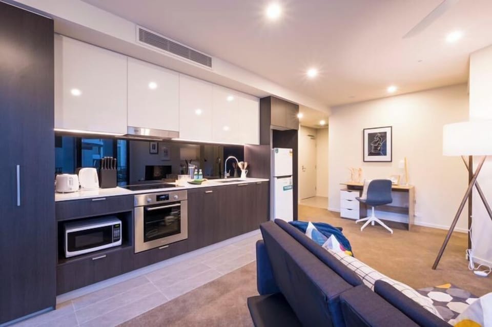 Apartment, 1 Bedroom (QBN550-607) | Living area | Flat-screen TV