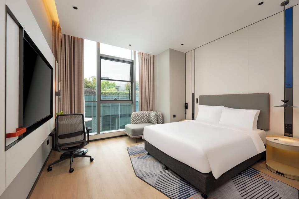 1 King Standard Extra Floor Space | Premium bedding, down comforters, desk, laptop workspace