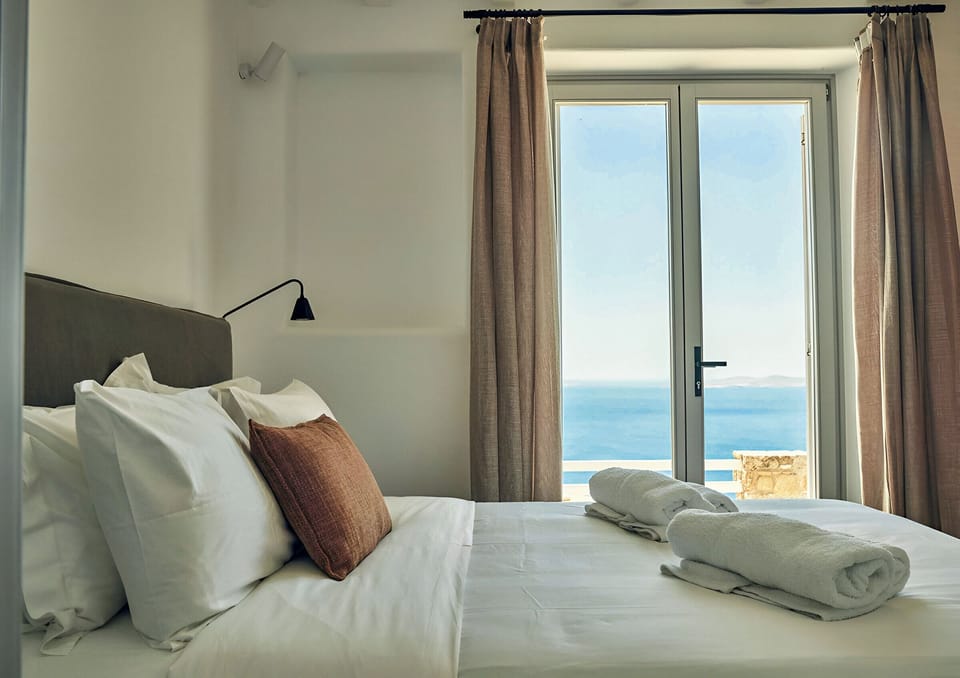 Deluxe Double Room, Patio, Sea View | Minibar, in-room safe, free WiFi