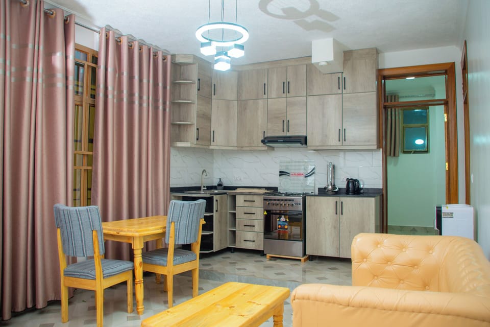 Basic Apartment, Hill View | Living area | 42-inch flat-screen TV with cable channels