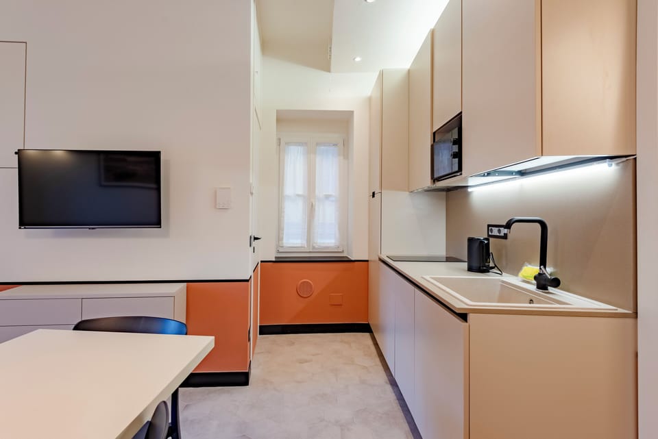 Apartment, 2 Bedrooms, Balcony, City View | Private kitchen | Dishwasher, espresso maker, electric kettle, dining tables