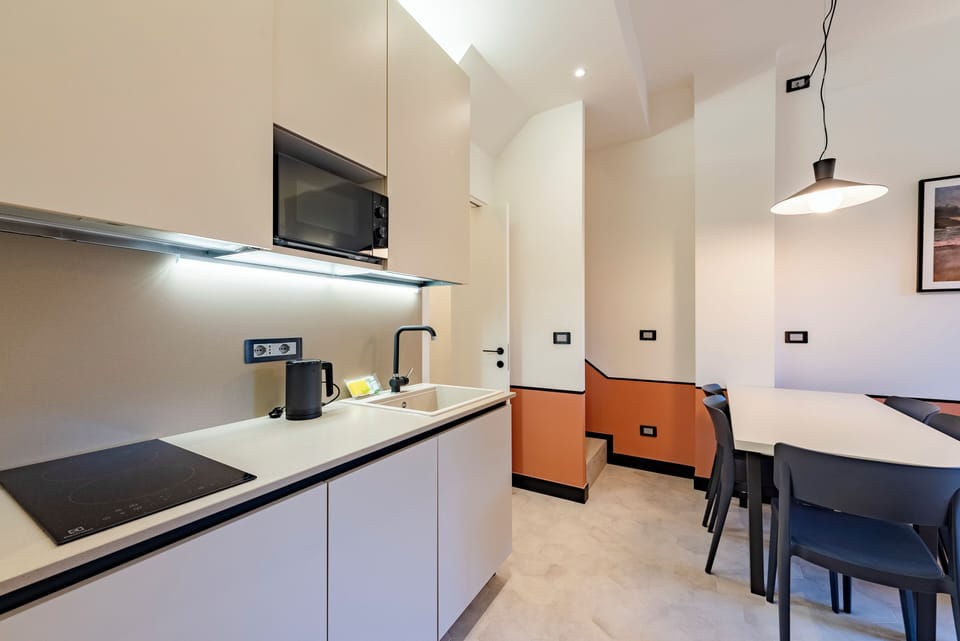 Apartment, 2 Bedrooms, Balcony, City View | Private kitchen | Dishwasher, espresso maker, electric kettle, dining tables