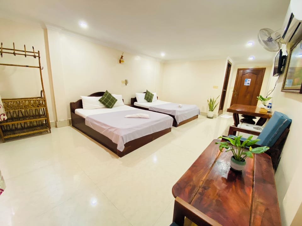 Family Room | Down comforters, desk, free WiFi, bed sheets