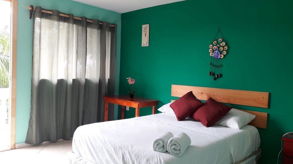 Basic Double Room, 1 Bedroom, Garden View | Desk, laptop workspace, blackout drapes, iron/ironing board (on request)