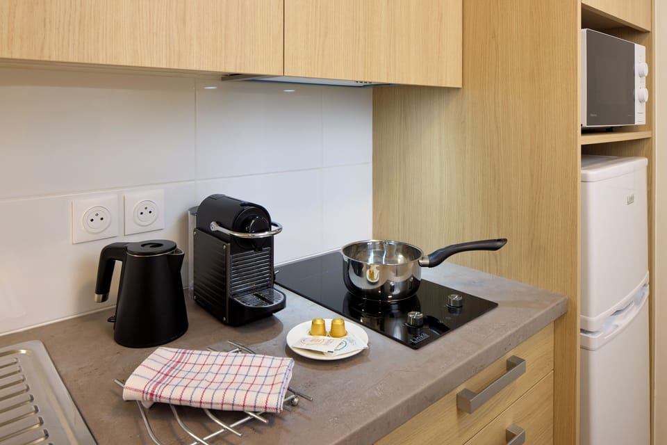 Mini-fridge, microwave, stovetop, cookware/dishes/utensils