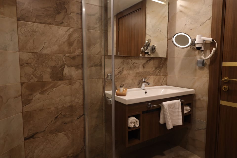 Shower, hair dryer, slippers, soap