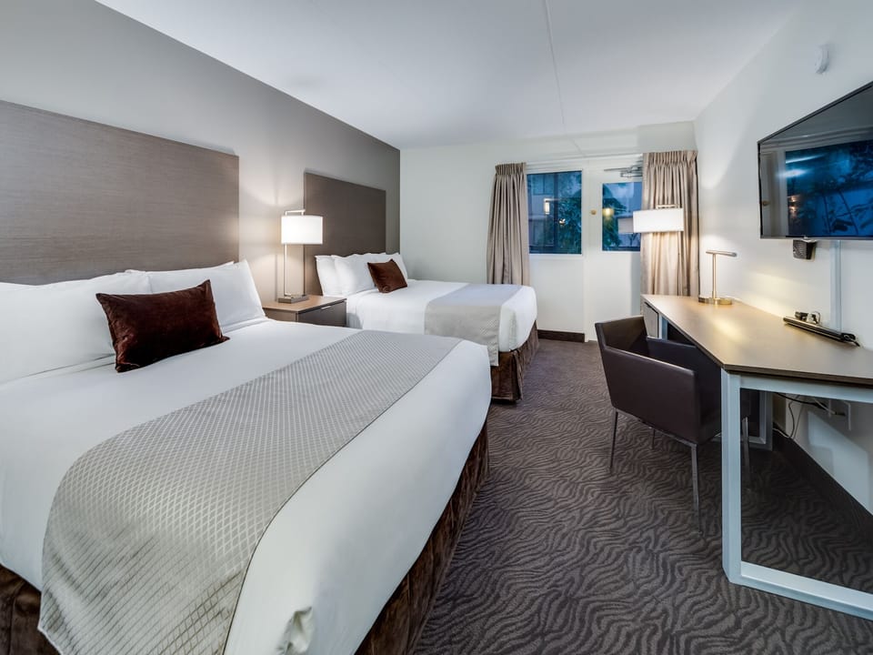 Premier Room, 2 Queen Beds | Desk, blackout drapes, WiFi (free), bed sheets