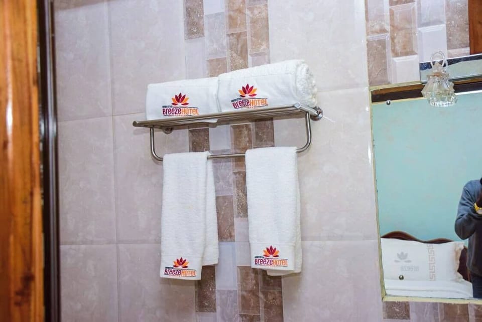 Shower, free toiletries, slippers, towels