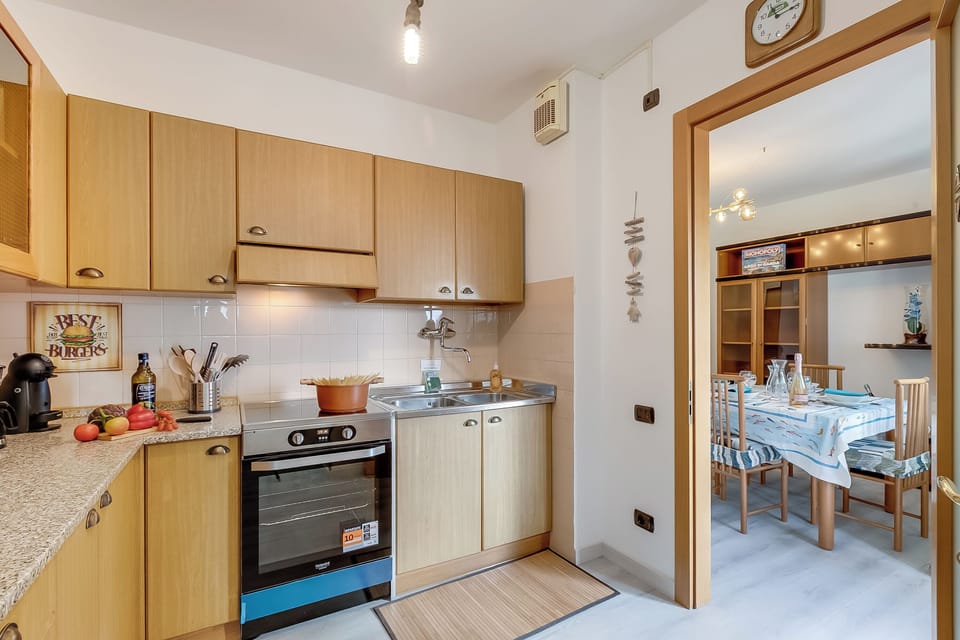 Standard Apartment, Multiple Bedrooms, 2 Bathrooms (Garda Lake View From The 7th Floor) | Private kitchen | Fridge, microwave, oven, stovetop