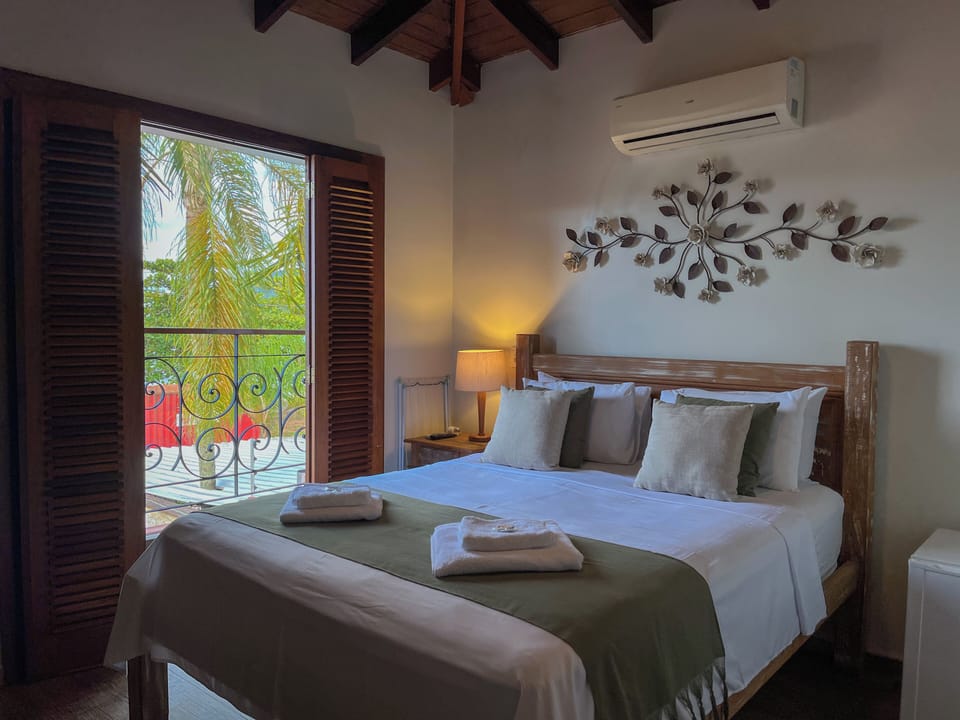Deluxe Double Room, Lanai, Beach View | Minibar, desk, laptop workspace, iron/ironing board