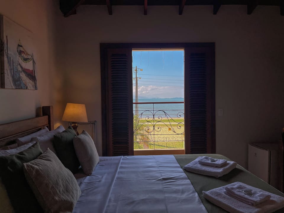 Luxury Double Room, Lanai, Beach View | Minibar, desk, laptop workspace, iron/ironing board