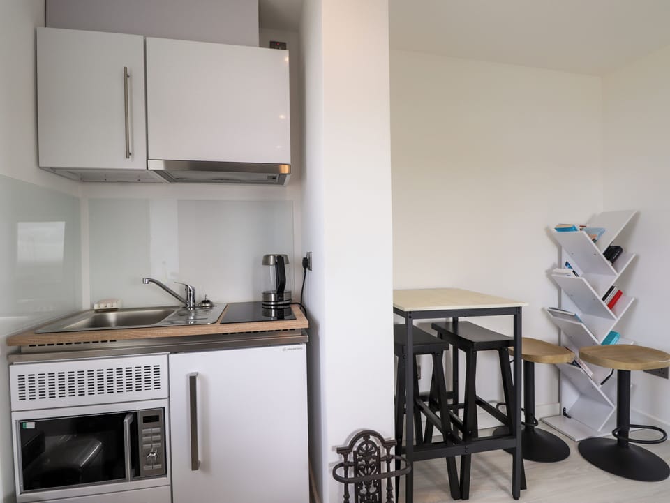 Fridge, microwave, cookware/dishes/utensils