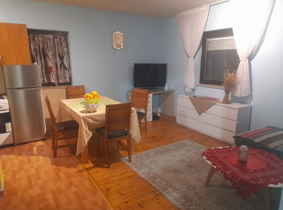 House (Holiday Home Village Paradise) | Living room | 32-inch flat-screen TV with cable channels