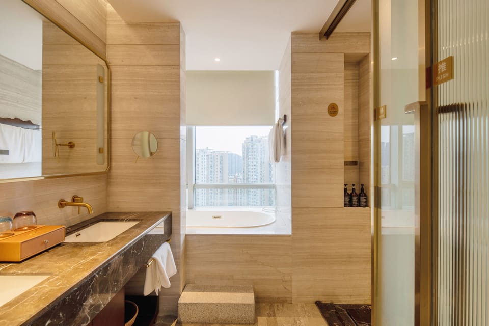 Deluxe Twin Room, City View | Bathroom | Hair dryer, slippers, bidet, towels