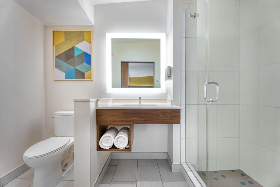 Designer toiletries, hair dryer, bathrobes, towels