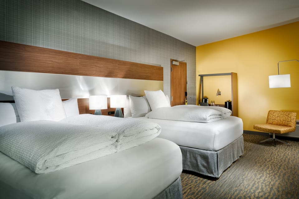 Premium bedding, pillowtop beds, desk, laptop workspace