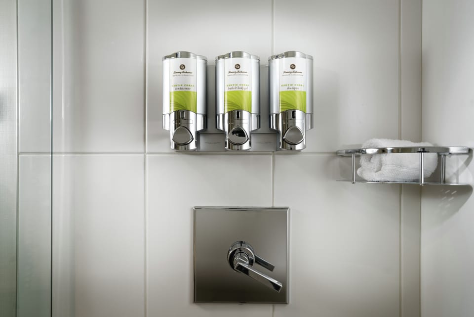 Designer toiletries, hair dryer, bathrobes, towels