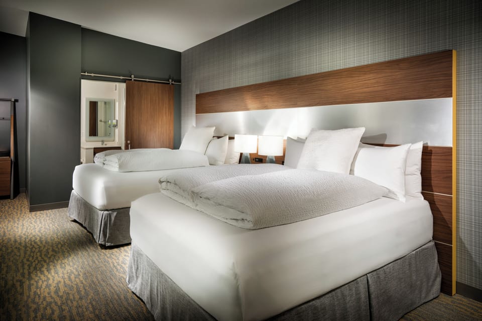 Premium bedding, pillowtop beds, desk, laptop workspace