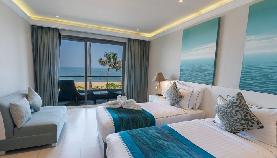 Deluxe Double or Twin Room, Balcony, Beach View | Desk, laptop workspace, free WiFi