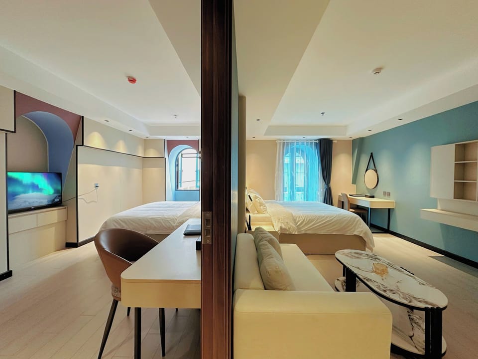 Family Quadruple Room, Balcony, City View | Minibar, desk, laptop workspace, free WiFi