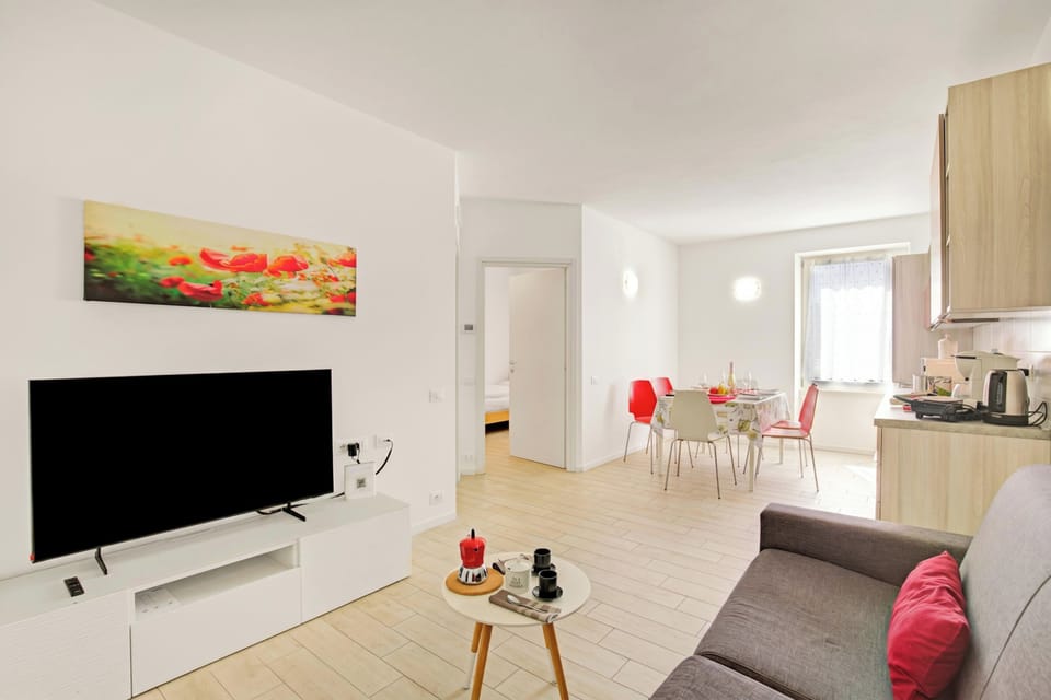 Standard Apartment, 2 Bedrooms, Microwave (Appartamento Dei Tigli with A/C) | Living area | Flat-screen TV