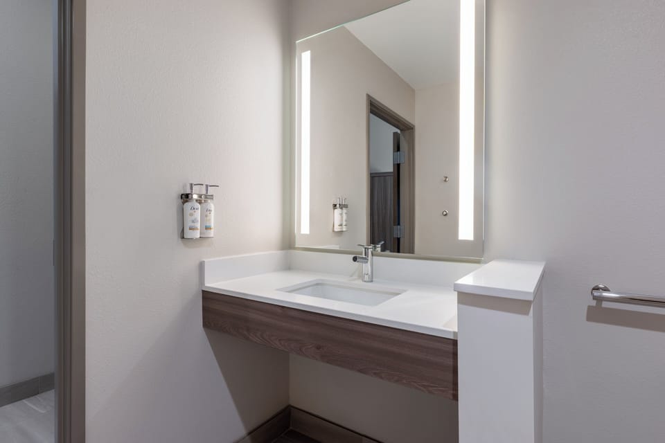 Desk, laptop workspace, blackout drapes, iron/ironing board