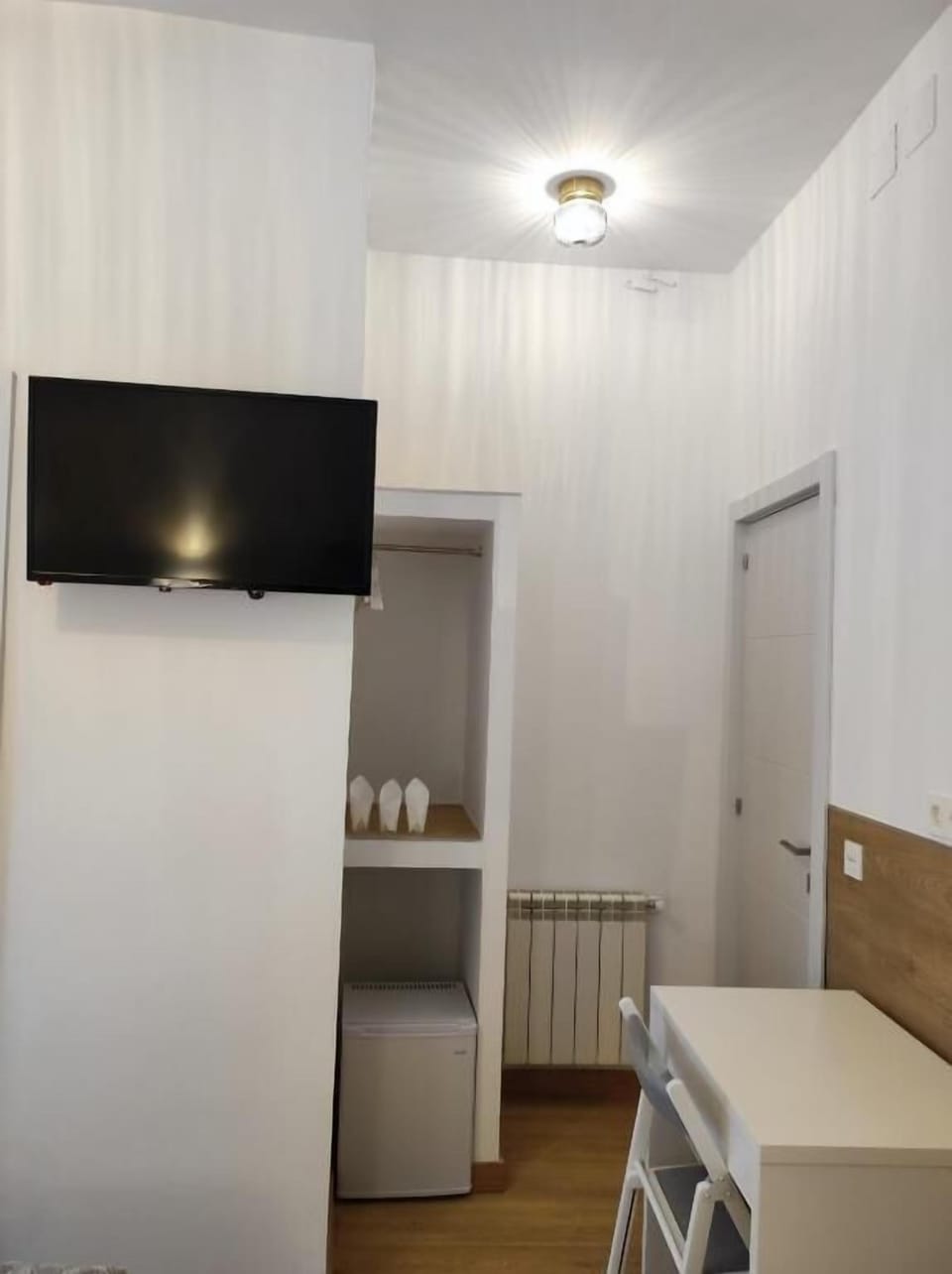Triple Room, City View | Living area | TV