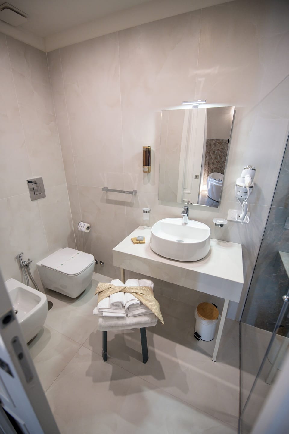 Jetted tub, rainfall showerhead, hair dryer, bidet
