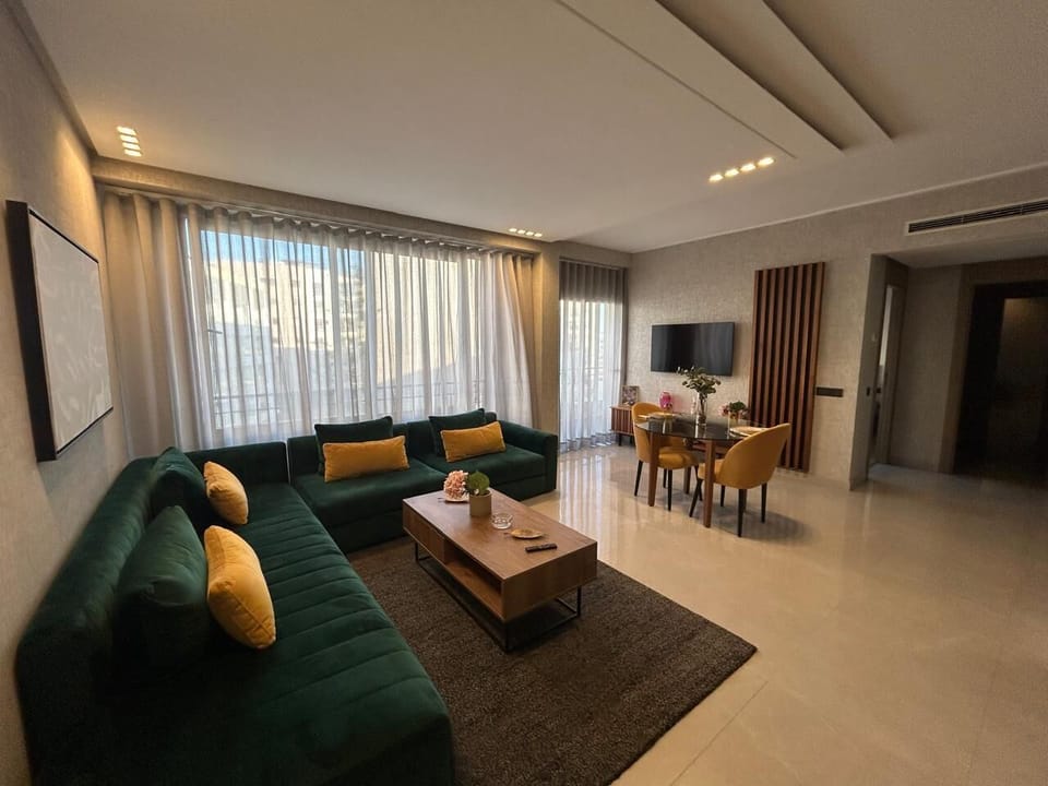 Deluxe Condo | Living area | 40-inch Smart TV with satellite channels, Netflix, pay movies
