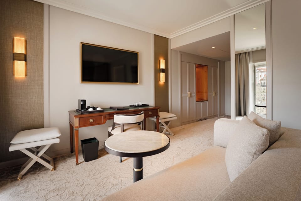 Prestige River View Room | Minibar, in-room safe, desk, blackout drapes