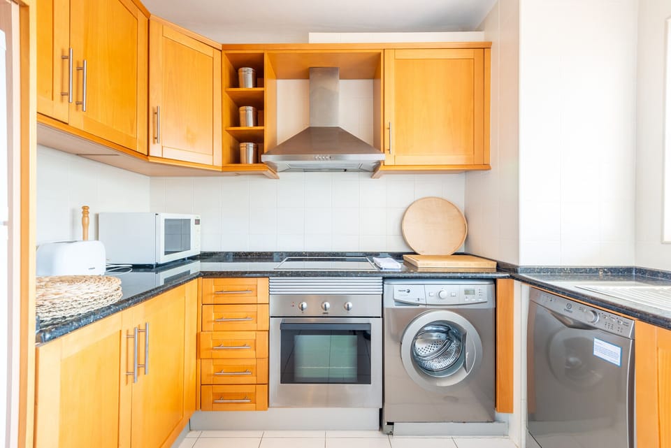 Apartment, 2 Bedrooms, Pool Access | Private kitchen | Coffee/tea maker, microwave, dishwasher, cookware/dishes/utensils