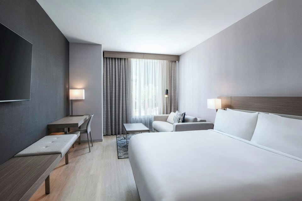 Deluxe Room, 1 King Bed with Sofa bed | In-room safe, desk, laptop workspace, blackout drapes