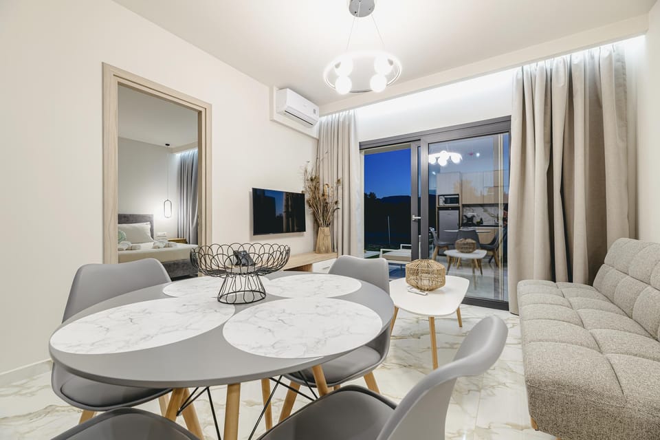 Suite, 2 Bedrooms | Living area | 50-inch flat-screen TV with cable channels