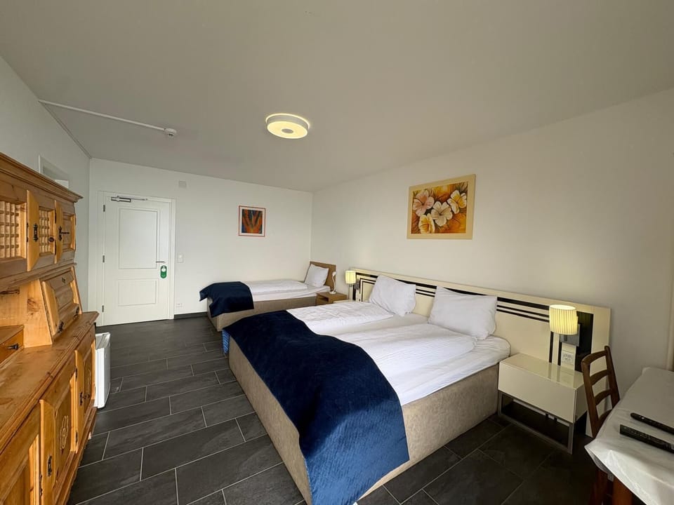 Superior Triple Room, Multiple Beds, Balcony, Lake View | Laptop workspace, free WiFi, bed sheets