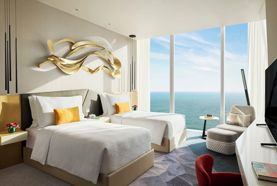 Deluxe Twin Oceanfront | Minibar (free items), in-room safe, desk, laptop workspace