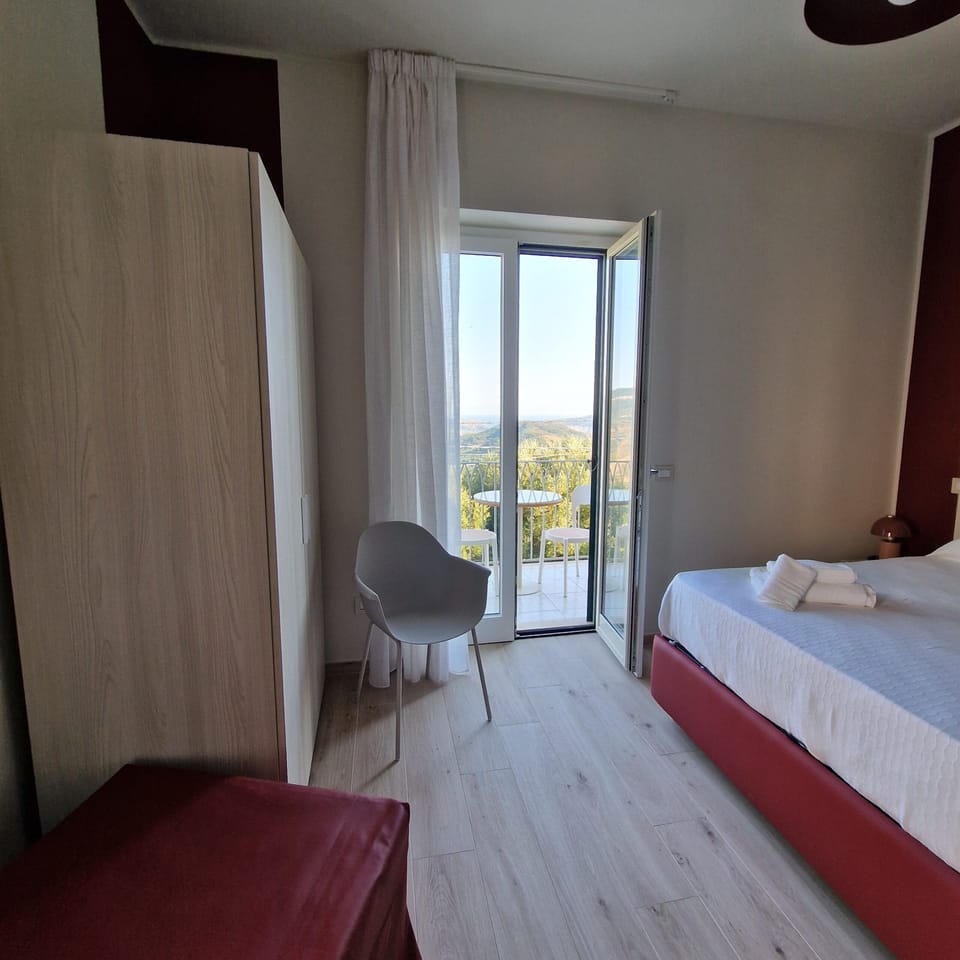Minibar, desk, laptop workspace, iron/ironing board
