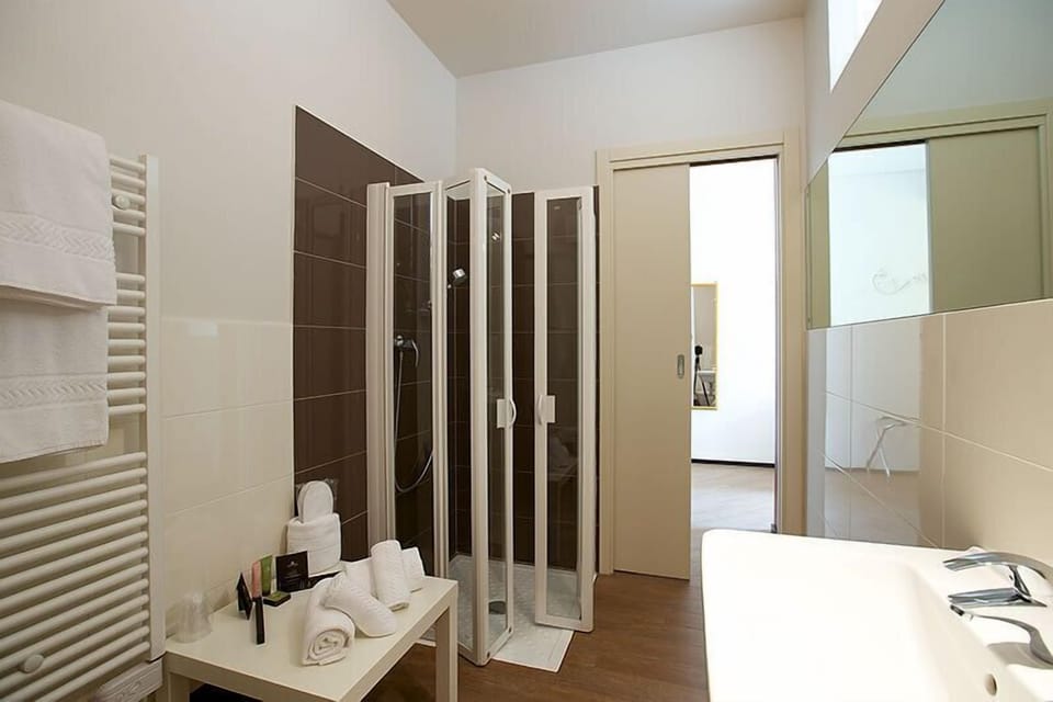 Shower, free toiletries, hair dryer, slippers