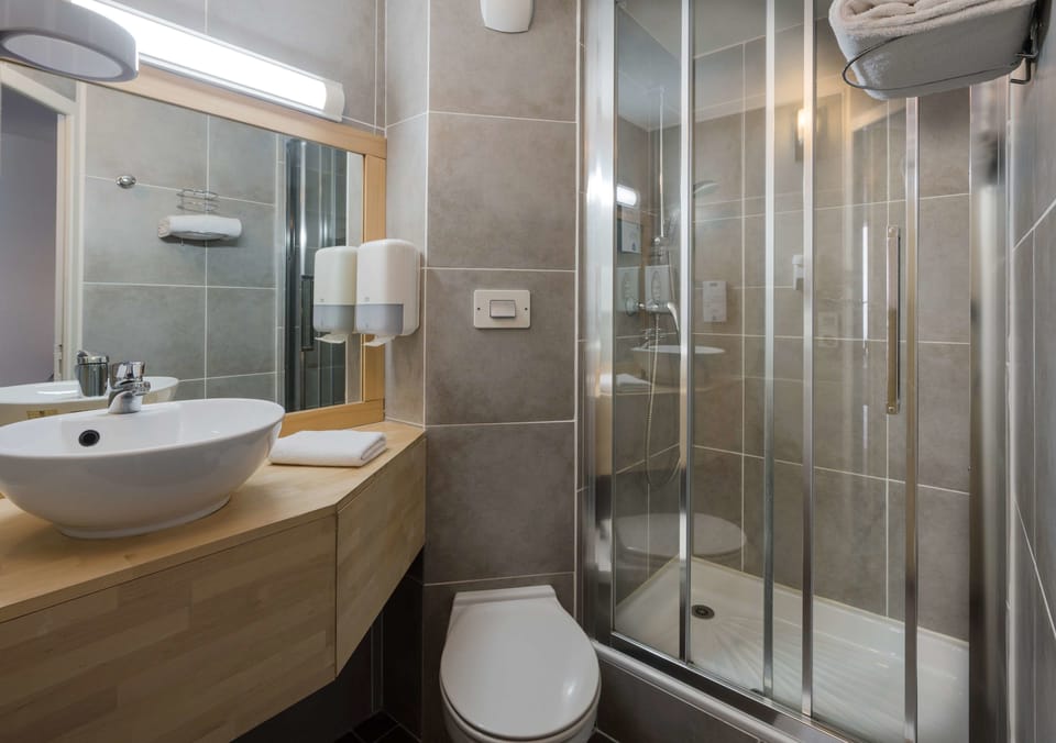 Eco-friendly toiletries, hair dryer, towels