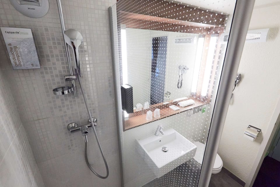 Shower, eco-friendly toiletries, hair dryer, towels